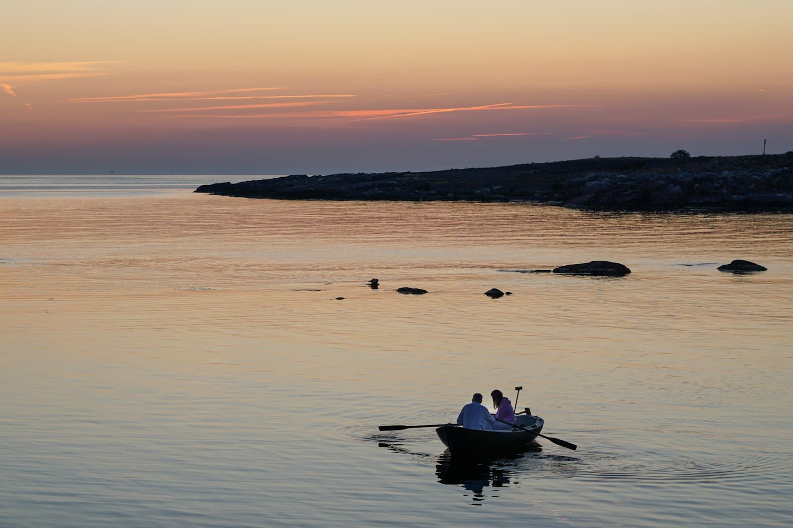 Romantic moment aboard a boat at sunset